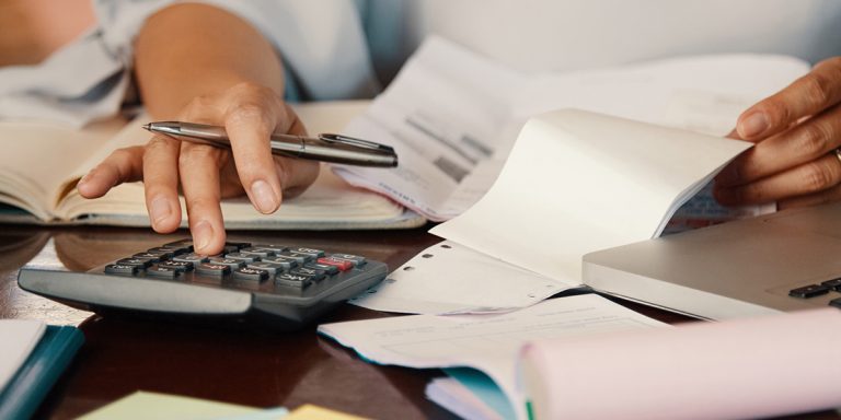 Entrepreneur working with bills
