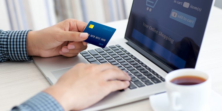 Man,Doing,Online,Shopping,With,Credit,Card,On,Laptop E-commerce